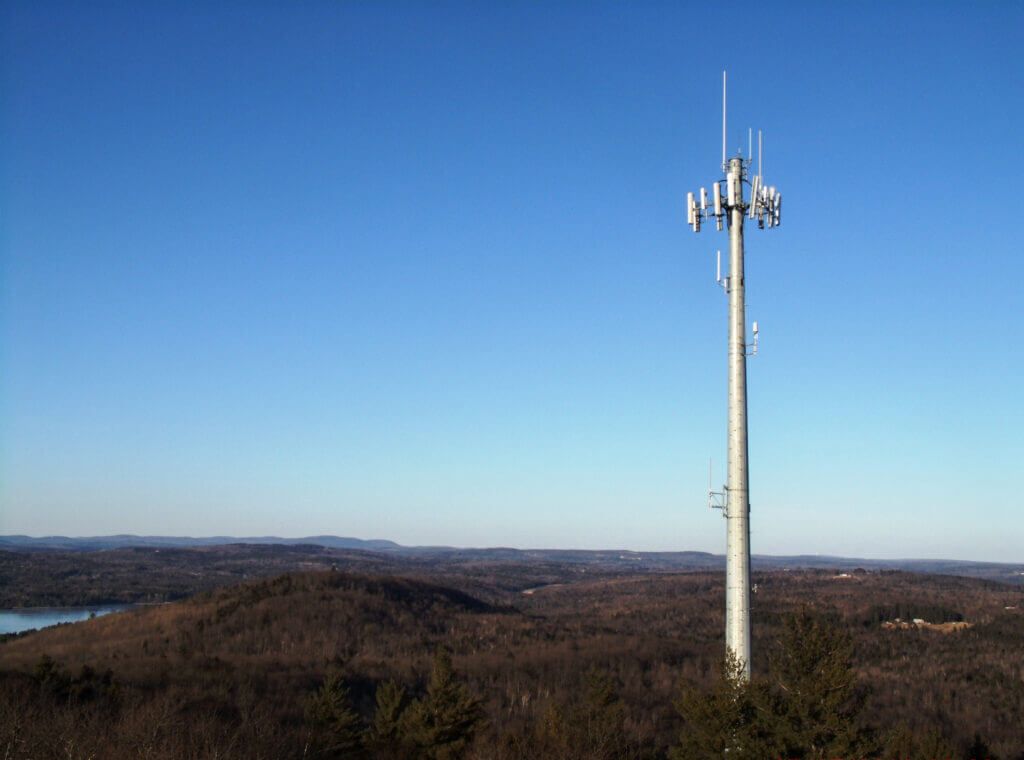 Cell tower against blue sky