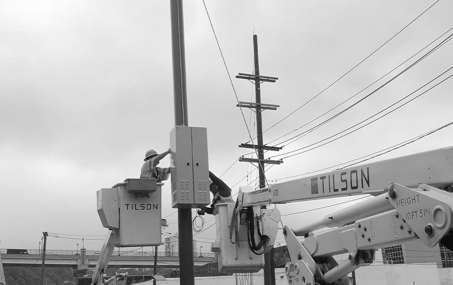 Workers on utility pole